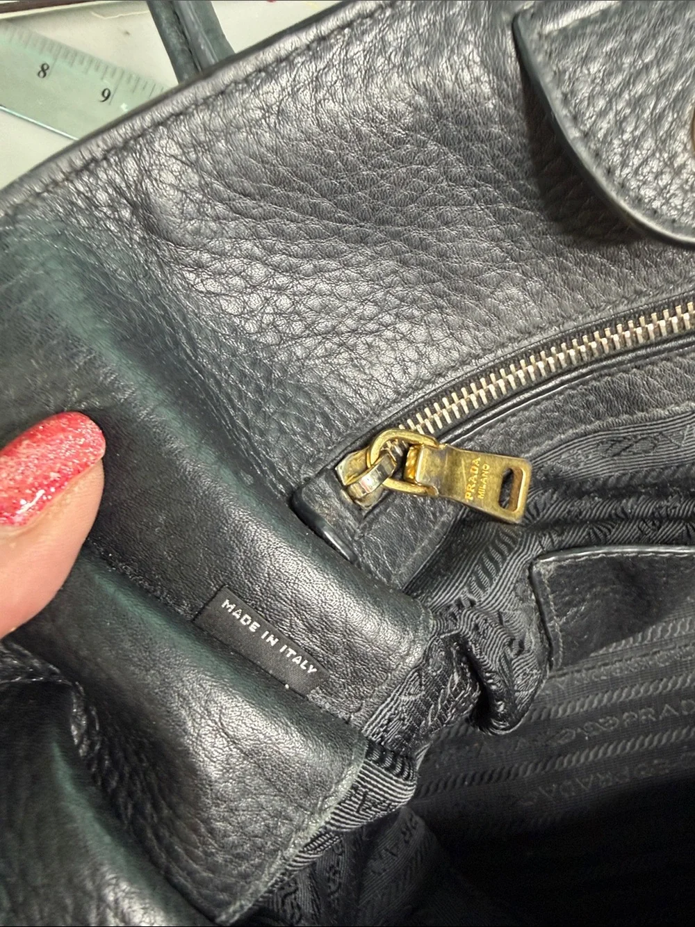 Authentic Prada Black  Leather Satchel with Gold Logo .